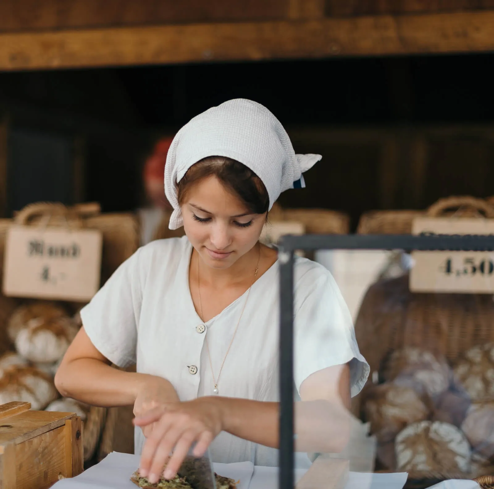Shop assistant serving a customer